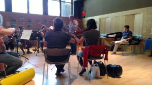 Nathan at the rehearsal in New York of his orchestra work, "The Light"